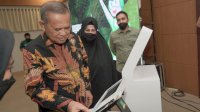Launching Buku Tamu-Anjungan Digital Desa, Bupati Basmin: Tak Ada Kata Terlambat untuk Tranformasi